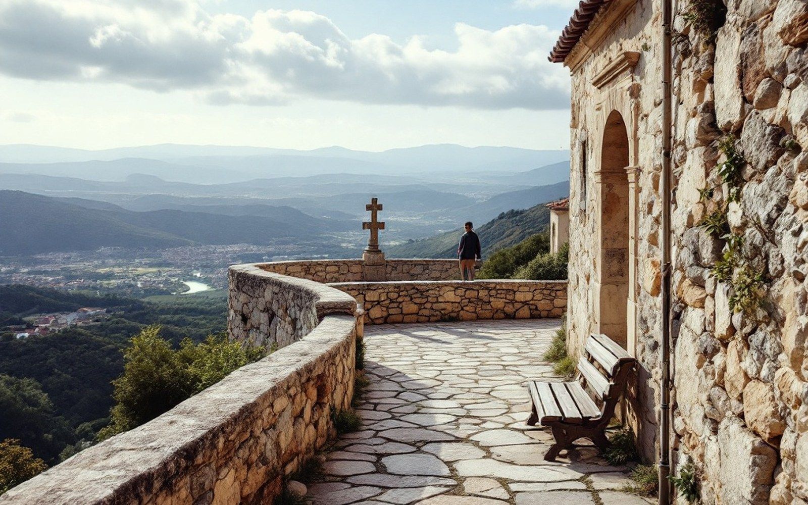 A short balustraded terrace walk on a ridge edge with a stone cross at one end